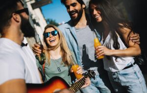 Group of friends hanging out, having fun and enjoying summer days