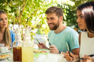 Friends sitting in outdoor restaurant