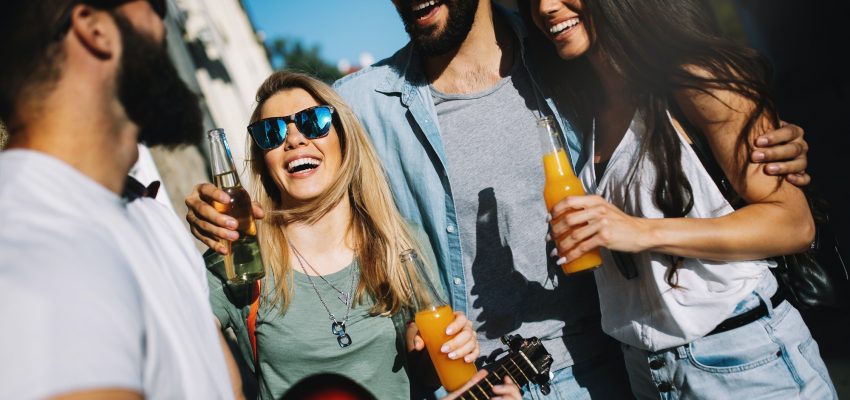 Group of friends hanging out, having fun and enjoying summer days