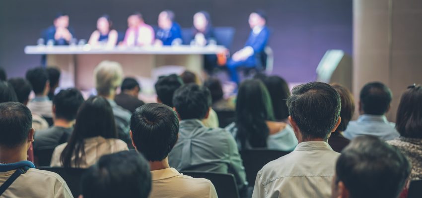 Rear view of Audience in the conference hall or seminar meeting