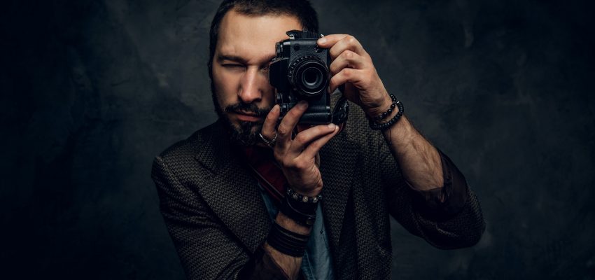 Reporter is taking a photo at photo studio